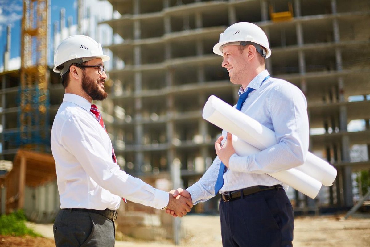 A dealer and our representative agreeing terms on site